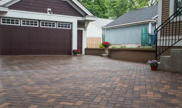 At Driveways Palmerston North, we do paved driveways enhanced with retaining walls and landscaped surroundings